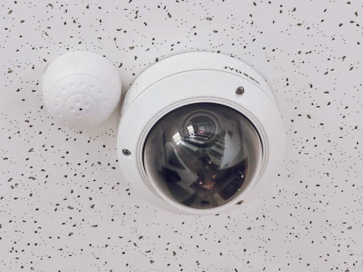 Dome CCTV camera mounted on a ceiling for indoor surveillance