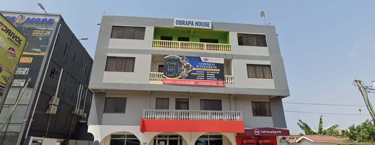 Modern office towers and palm-lined streets in central Accra